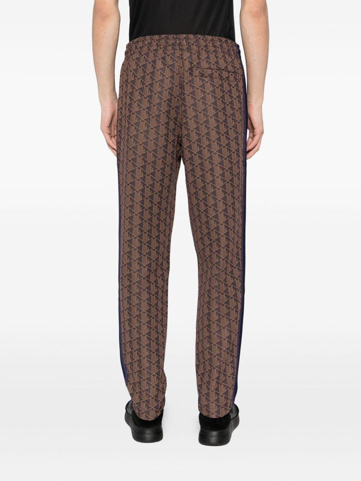 Pantaloni marrone scuro con applicazione logo 