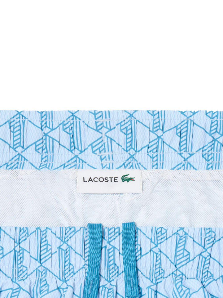 Costume bianco e azzurro con stampa geometrica 