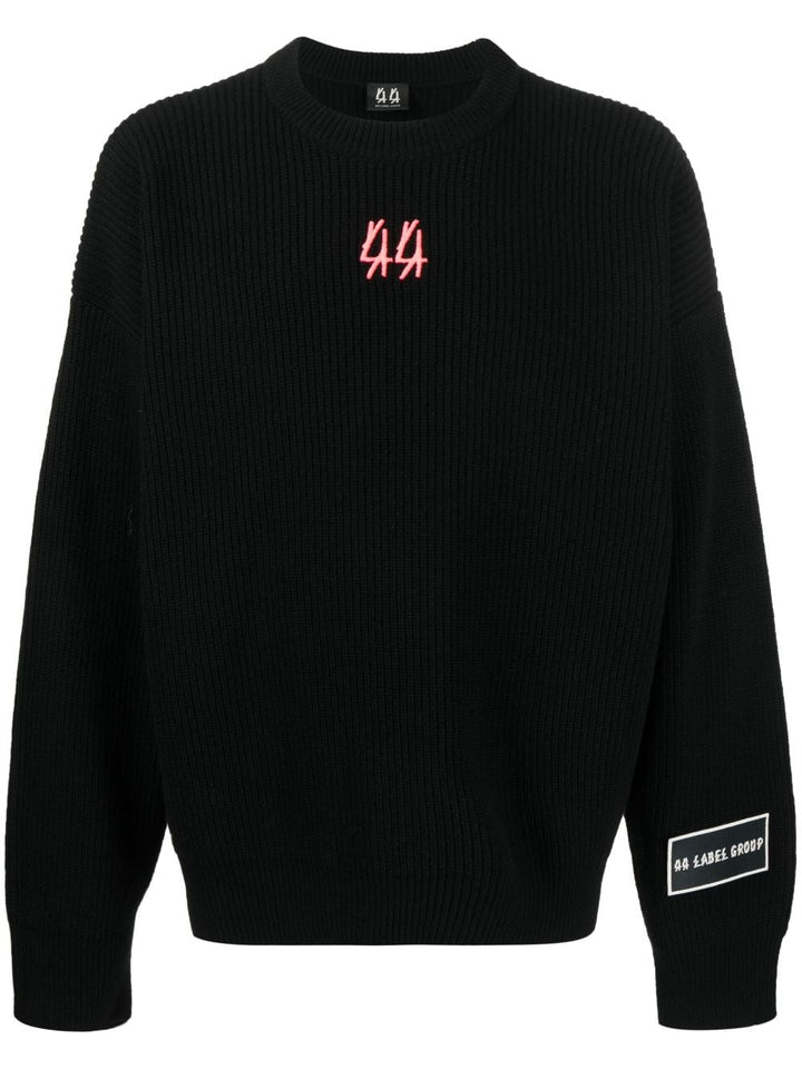 black sweater with red logo on the back