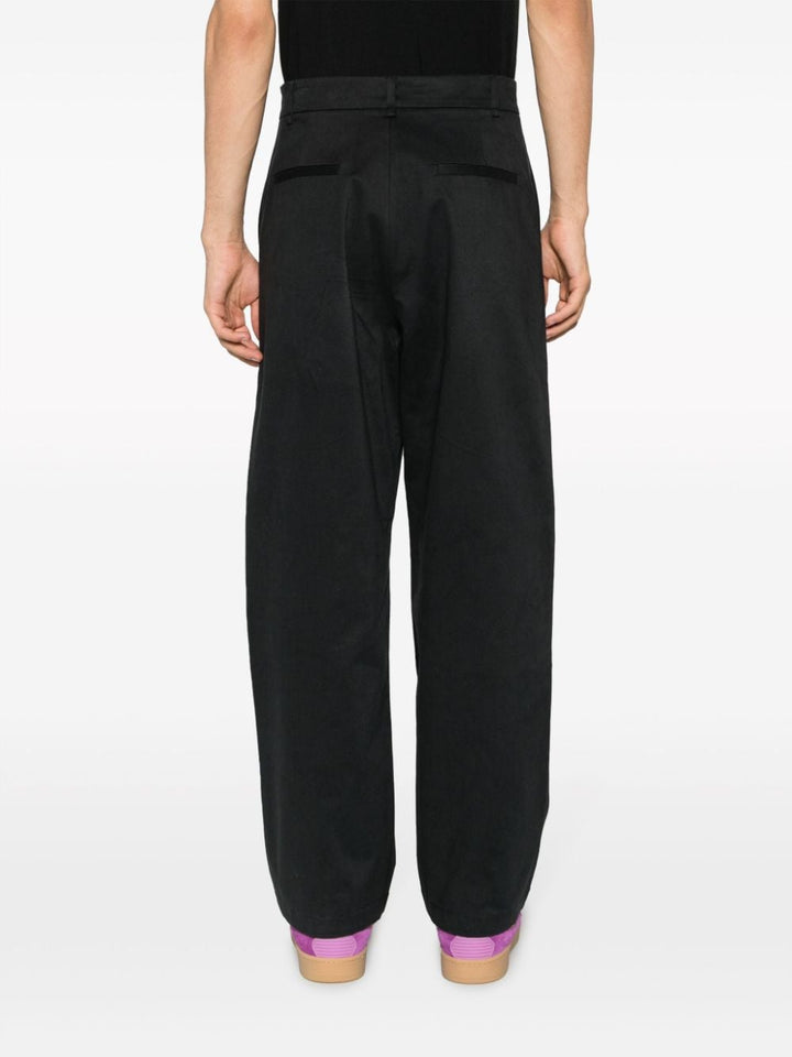 black trousers with metallic details