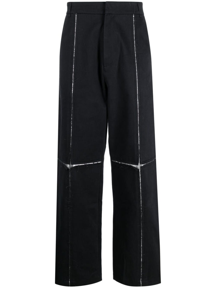 black trousers with metallic details