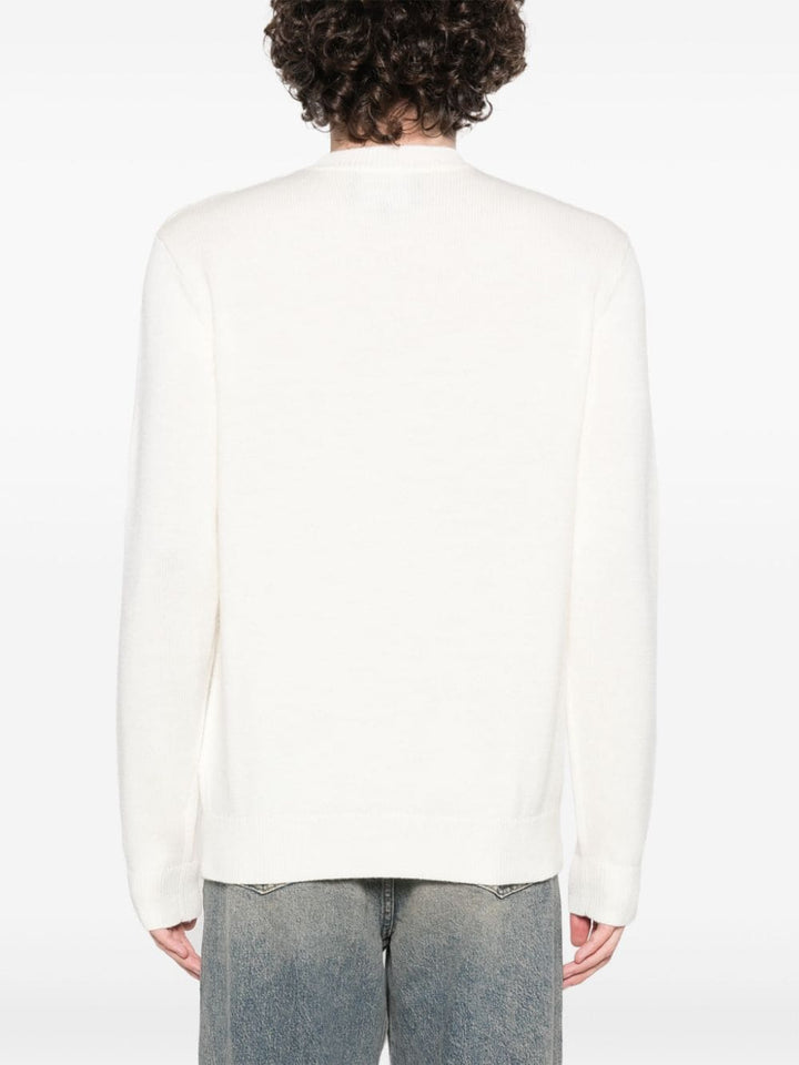 white sweater with embroidered logo