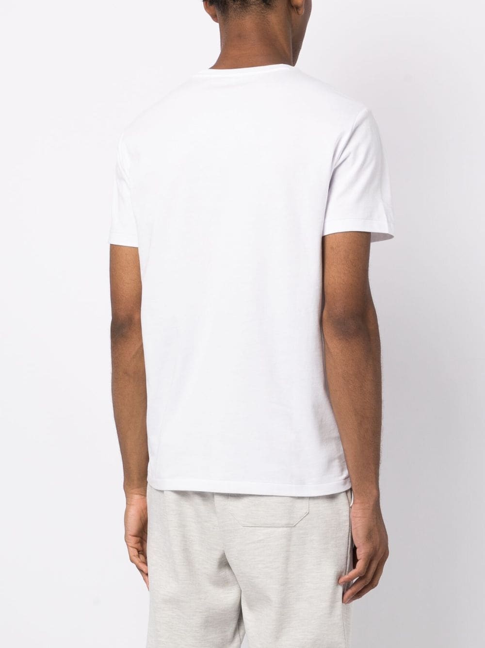 t-shirt bianca con logo centrale